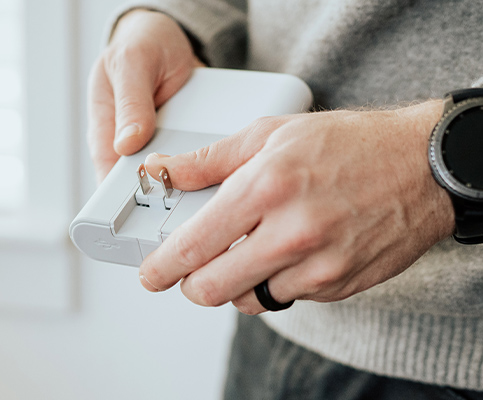 Portable plug-in power bank with easy charging solution.