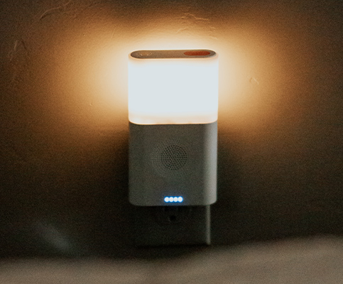 Wall-mounted night light with power bank and fm radio speaker.