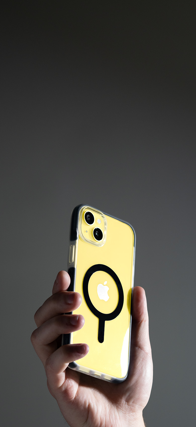 Man holding phone with a bodyguardz case on it.