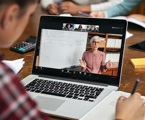 Teacher and student in a virtual classroom and learning remotely.