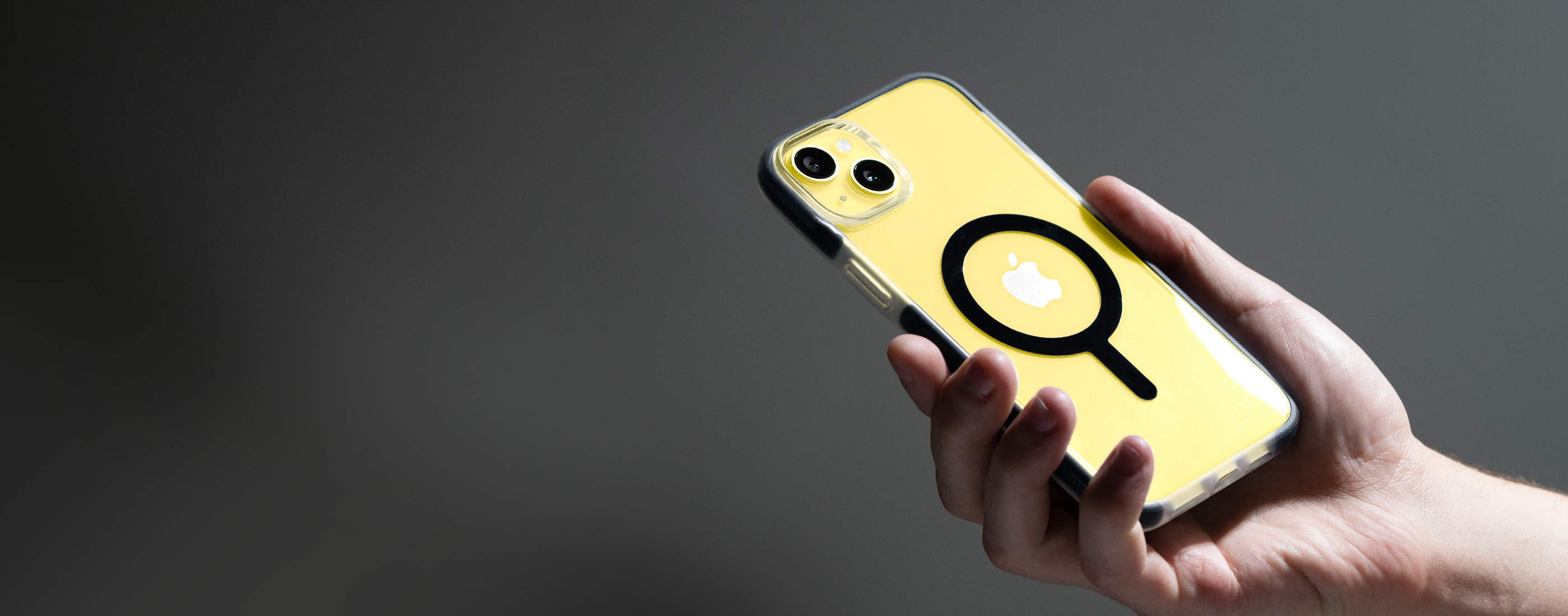Man holding phone with a bodyguardz case on it.