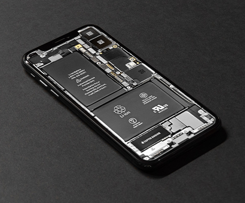 Exposed iPhone components featuring lithium-ion battery, taptic engine